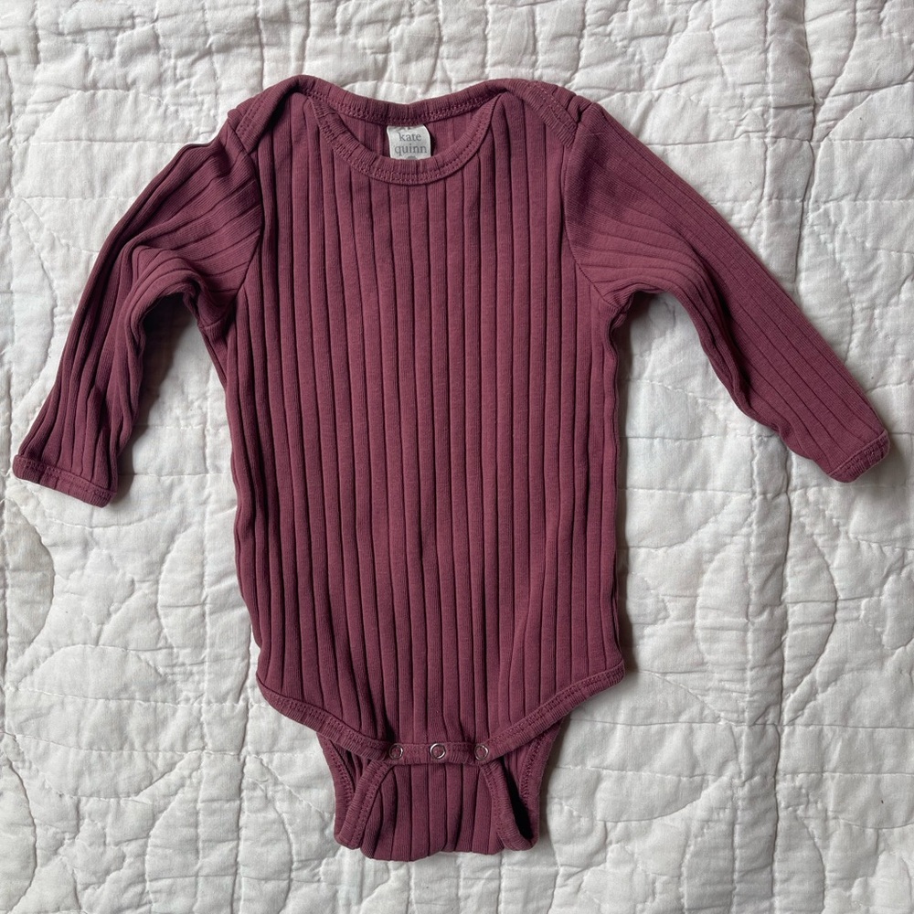Kate Quinn long sleeved lap neck bodysuit classic rib in wild ginger (plum)